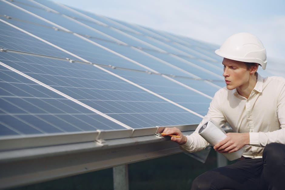 A smiling solar installation expert reviewing plans outside a residential home